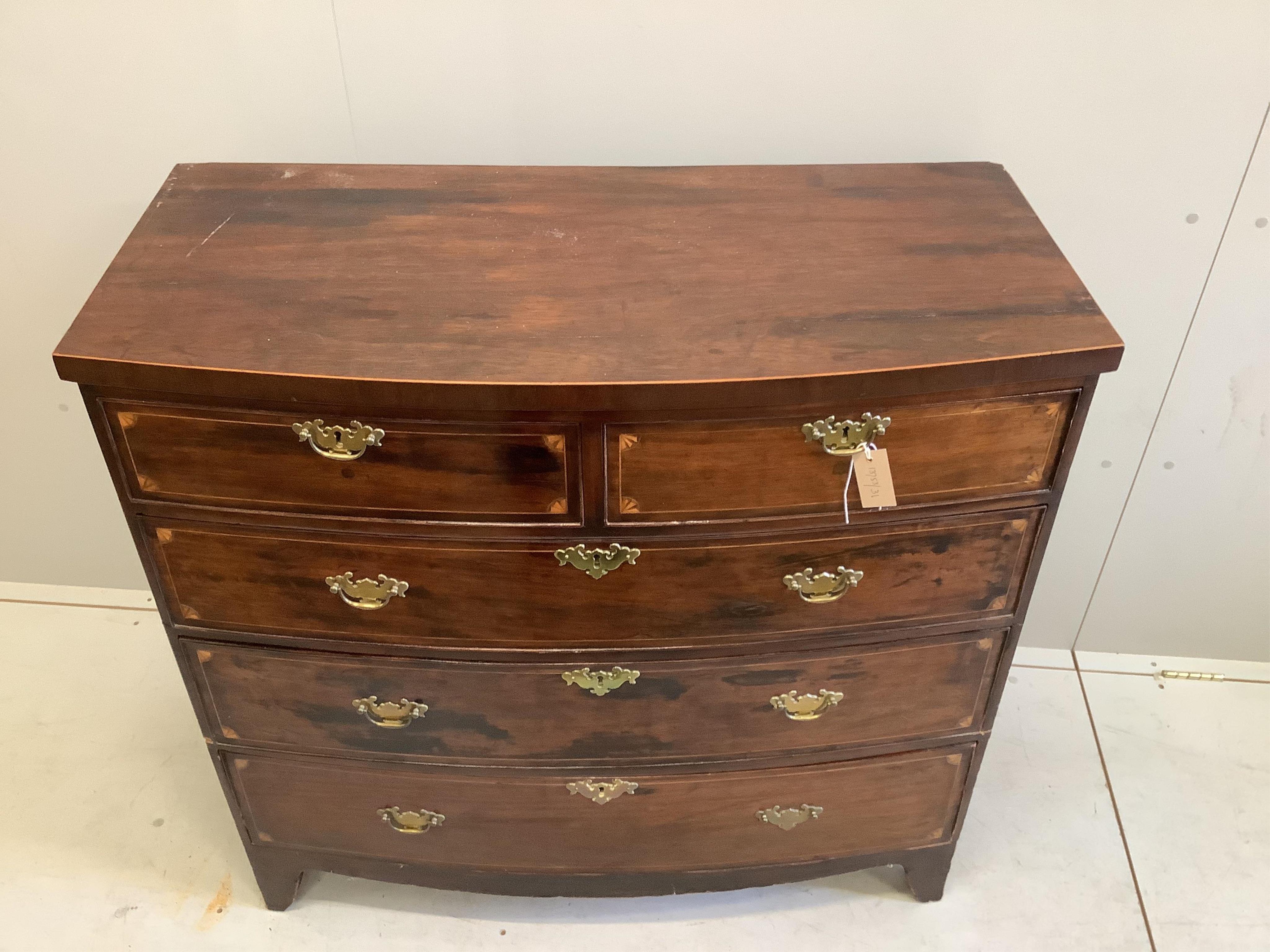 A late Georgian mahogany bowfront chest fitted two short and three long drawers, line and fan inlay, brass handles on splay bracket feet, width 106cm, depth 50cm, height 101cm